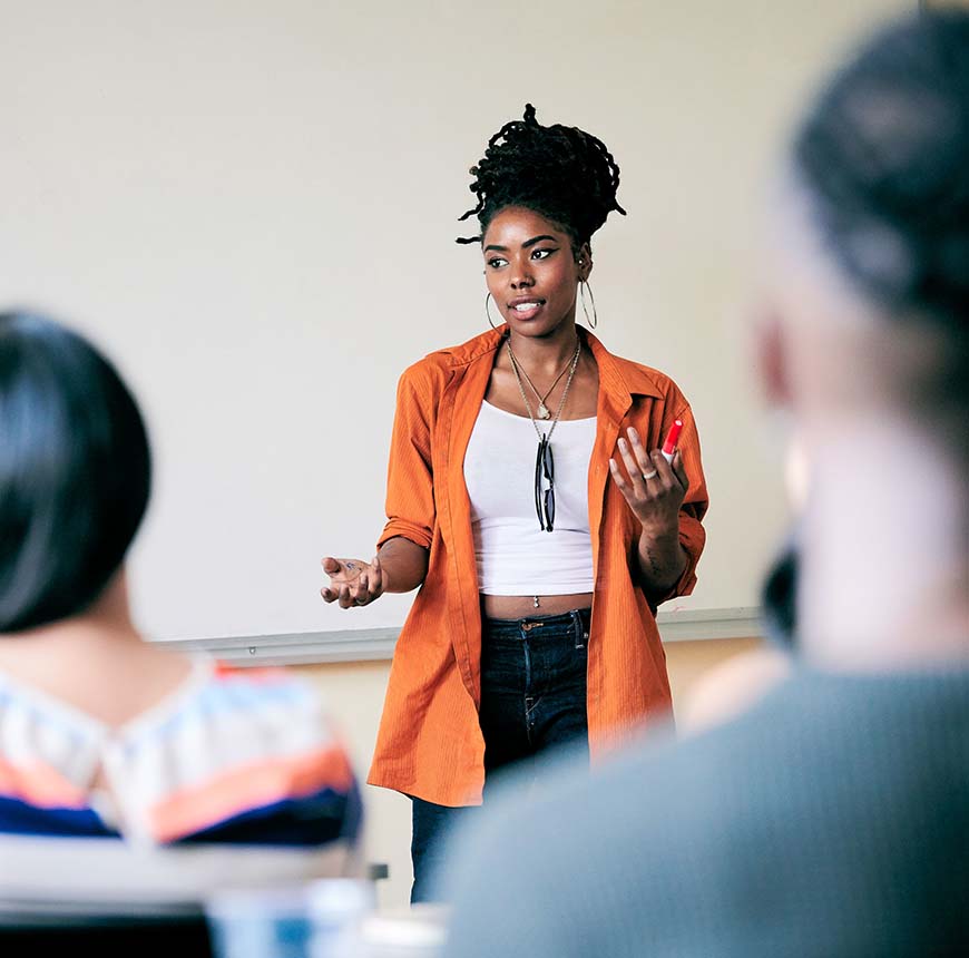 woman-speaking-in-front-of-classroom