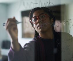 content-woman-writing-on-window